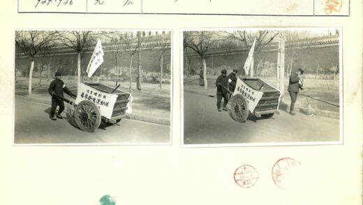 制服人员街道清扫拉横幅.jpg