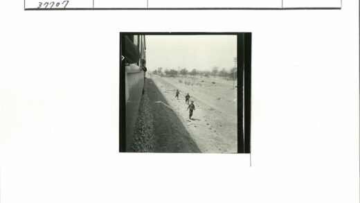 儿童行走土路火车旁树林背景.jpg