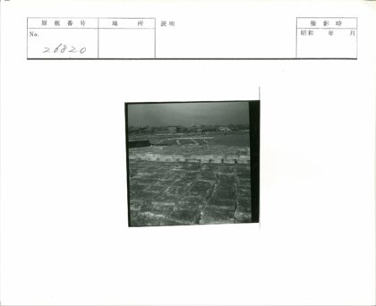 多云天空下冰块与建筑田野.jpg