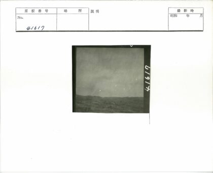 多云天空下的山丘与建筑.jpg