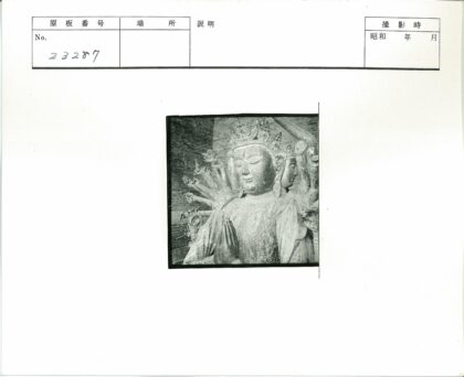 多臂雕像砖墙背景.jpg