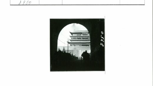 拱门内多层传统建筑与自行车前景.jpg