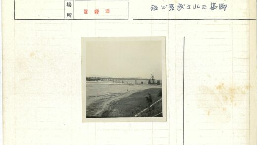 河岸泥路与建筑起重机景观.jpg