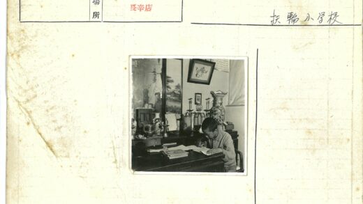 男孩书桌前写作与军帽陈设.jpg