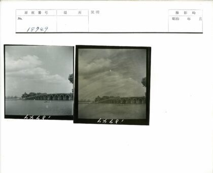 石桥凉亭与船在多云天空下.jpg