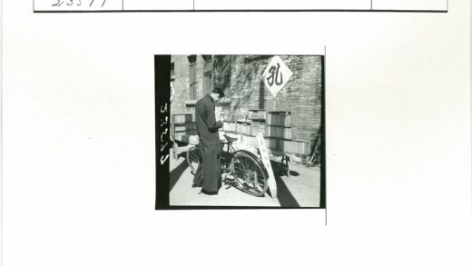 砖房外自行车旁的人看书.jpg